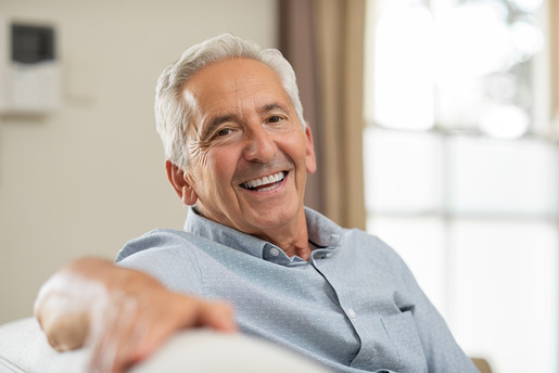 man smiling after getting dental implants 