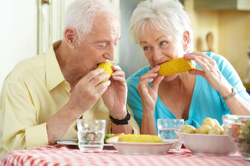 couple eating corn on the cob